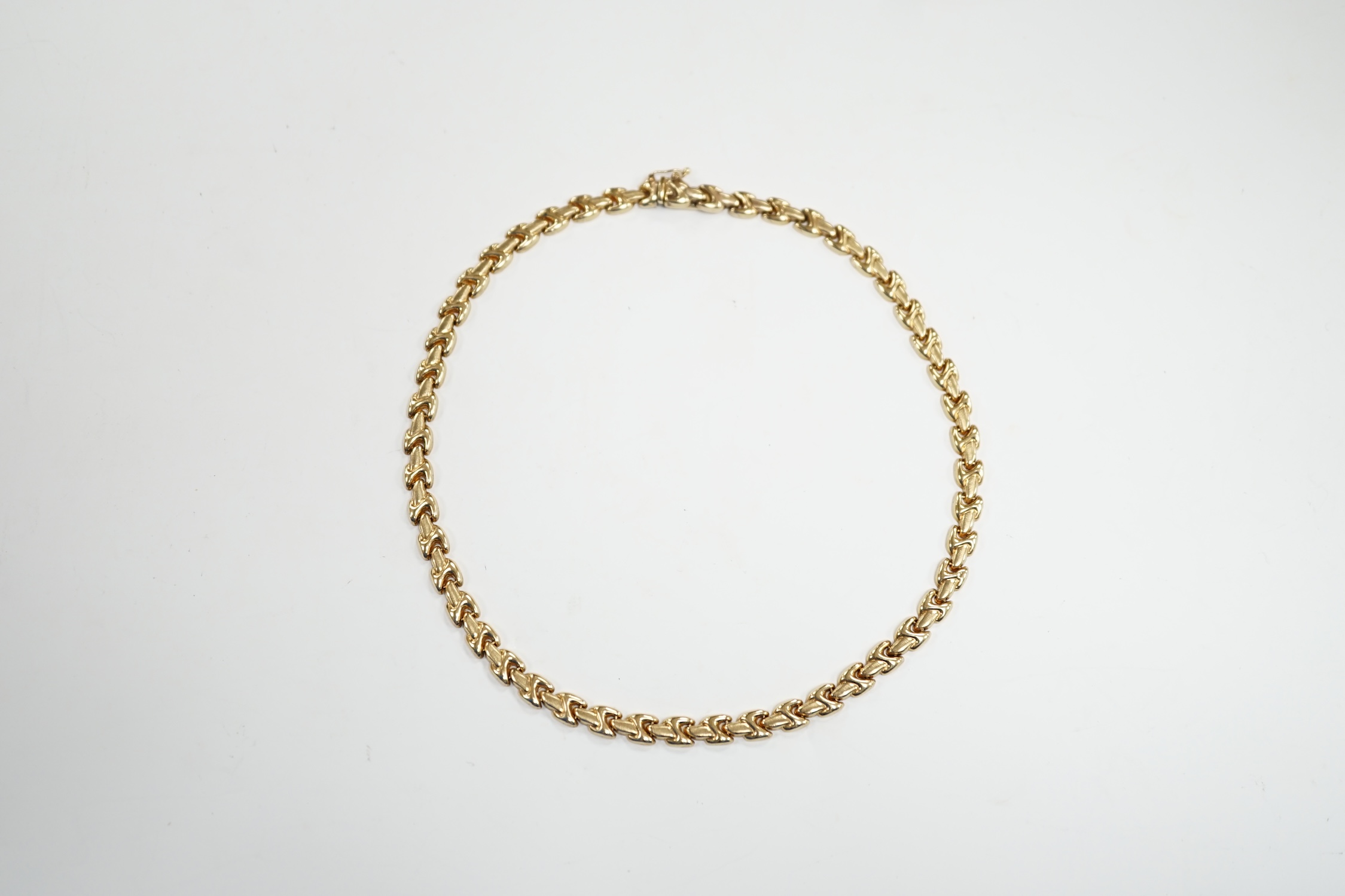 A modern 9ct gold flat link necklace, 34cm, 11.5 grams.